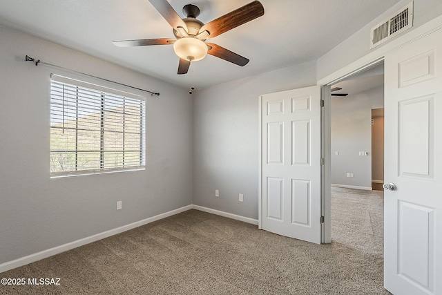 101 S Players Club Dr Unit 11204, Tucson, AZ 85745 - unfurnished bedroom featuring carpet, baseboards, and ceiling fan