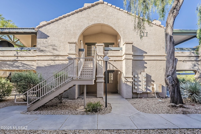 101 S Players Club Dr Unit 11204, Tucson, AZ 85745 - view of front of home featuring stucco siding and a tile roof