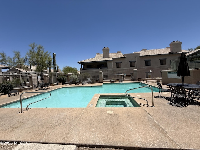 101 S Players Club Dr Unit 11204, Tucson, AZ 85745 - community pool featuring a community hot tub and a patio