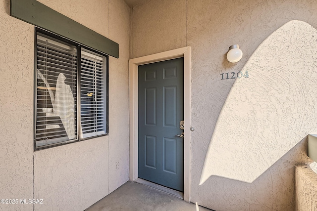 101 S Players Club Dr Unit 11204, Tucson, AZ 85745 - view of exterior entry featuring stucco siding