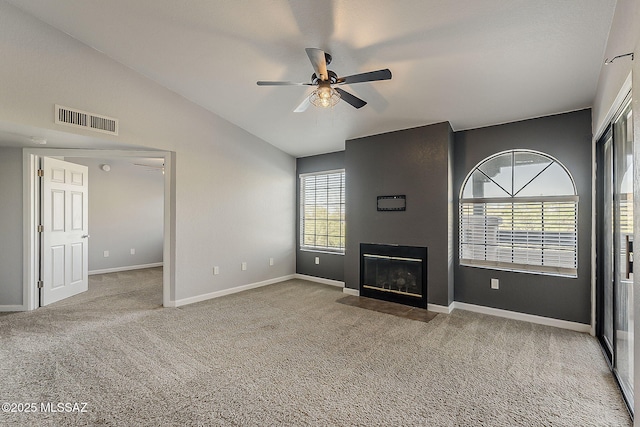 101 S Players Club Dr Unit 11204, Tucson, AZ 85745 - unfurnished living room with ceiling fan, carpet flooring, baseboards, and vaulted ceiling