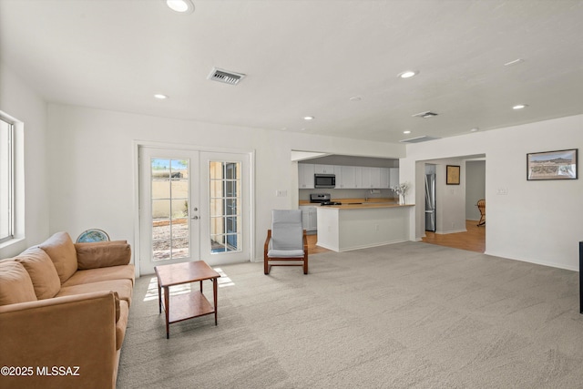 2917 E Malvern St, Tucson, AZ 85716 - living room featuring light colored carpet, recessed lighting, and french doors