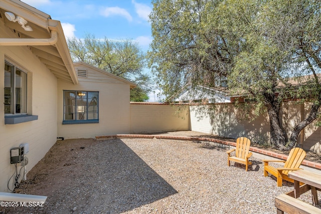 2917 E Malvern St, Tucson, AZ 85716 - fenced backyard featuring a patio area and a fire pit