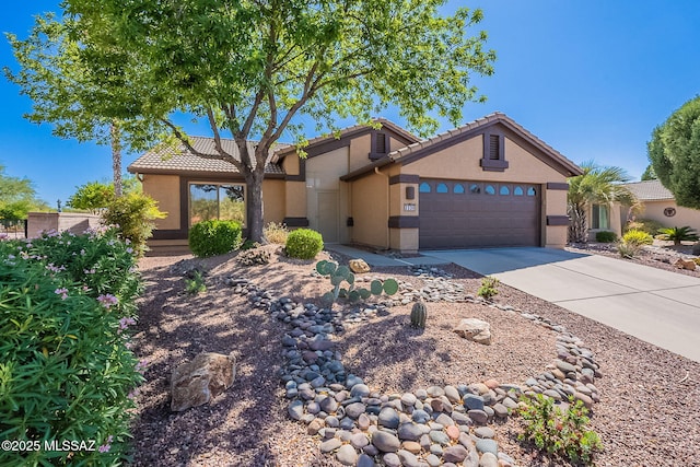 2136 E Desert Fox Dr, Green Valley, AZ 85614 - view of front of property featuring stucco siding, an attached garage, concrete driveway, and a tile roof