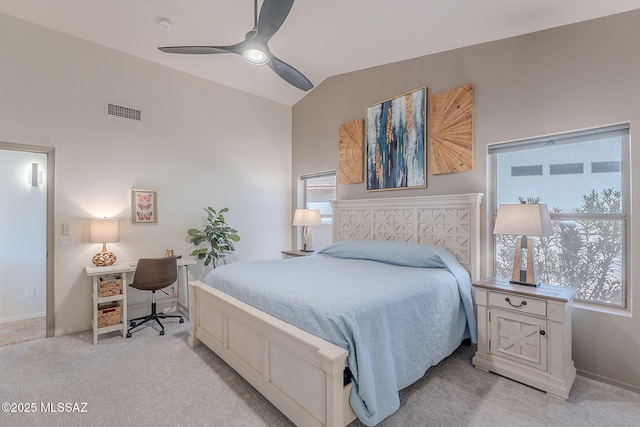 2136 E Desert Fox Dr, Green Valley, AZ 85614 - bedroom with light colored carpet, an office area, multiple windows, lofted ceiling, and a ceiling fan