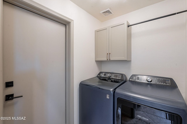 2136 E Desert Fox Dr, Green Valley, AZ 85614 - washroom with cabinet space and washer and clothes dryer
