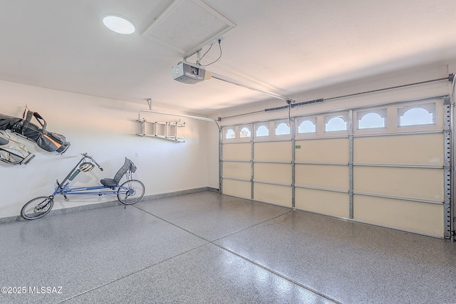 2136 E Desert Fox Dr, Green Valley, AZ 85614 - garage featuring a garage door opener and baseboards