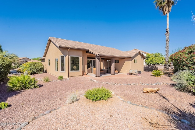 2136 E Desert Fox Dr, Green Valley, AZ 85614 - rear view of house with a tiled roof, stucco siding, and a patio area