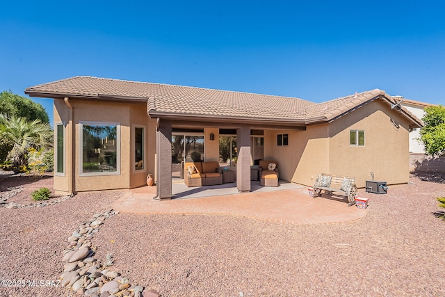 2136 E Desert Fox Dr, Green Valley, AZ 85614 - rear view of house with a patio area, outdoor lounge area, a tile roof, and stucco siding
