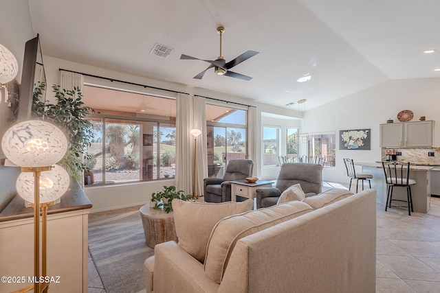 2136 E Desert Fox Dr, Green Valley, AZ 85614 - living area with lofted ceiling, ceiling fan, light tile patterned floors, and recessed lighting