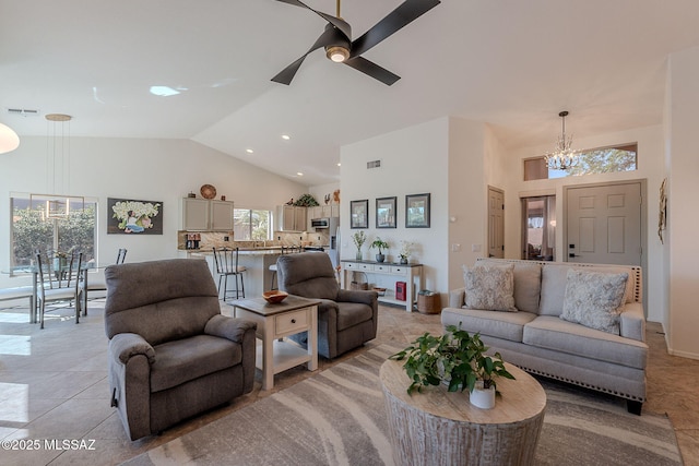 2136 E Desert Fox Dr, Green Valley, AZ 85614 - living room featuring high vaulted ceiling, a chandelier, ceiling fan, and light tile patterned flooring