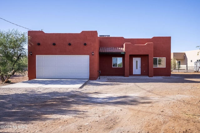 1801 Saltillo Ct, Rio Rico, AZ 85648 - southwest-style home with concrete driveway, an attached garage, and stucco siding