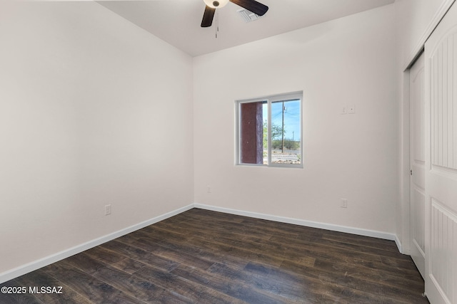 1801 Saltillo Ct, Rio Rico, AZ 85648 - unfurnished bedroom with dark wood-style flooring, baseboards, a closet, and ceiling fan