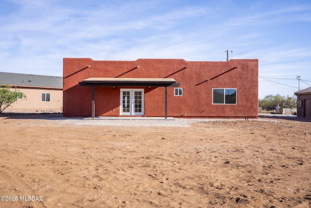 1801 Saltillo Ct, Rio Rico, AZ 85648 - rear view of property with french doors and stucco siding