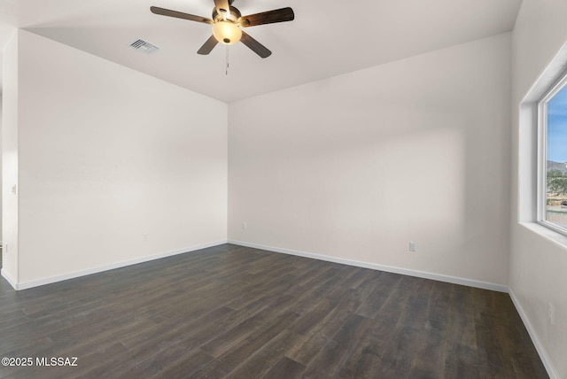 1801 Saltillo Ct, Rio Rico, AZ 85648 - spare room with ceiling fan, dark wood-style flooring, and baseboards