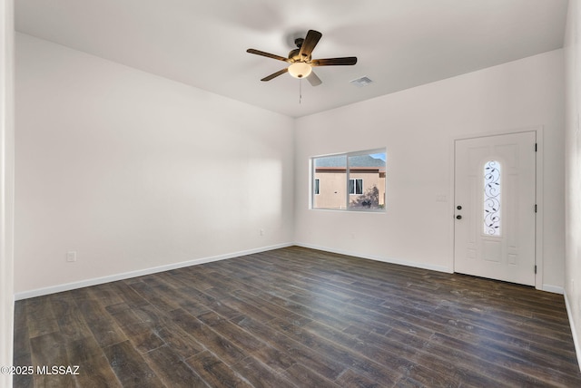 1801 Saltillo Ct, Rio Rico, AZ 85648 - entryway with a ceiling fan, dark wood-type flooring, and baseboards