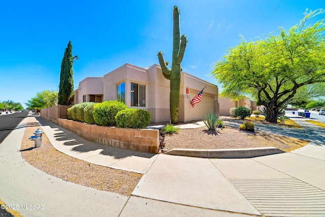 7466 E Placita Del Misterio, Tucson, AZ 85715 - pueblo-style house with a garage and stucco siding
