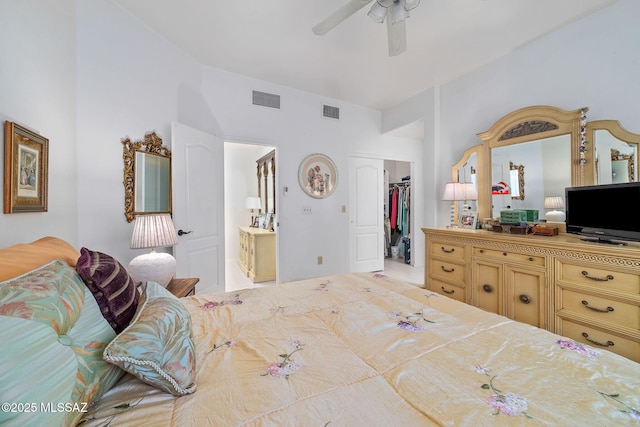 7466 E Placita Del Misterio, Tucson, AZ 85715 - bedroom featuring lofted ceiling, a spacious closet, ensuite bath, a closet, and ceiling fan