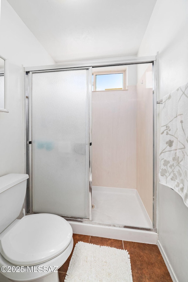 7466 E Placita Del Misterio, Tucson, AZ 85715 - bathroom featuring toilet, a stall shower, and tile patterned floors