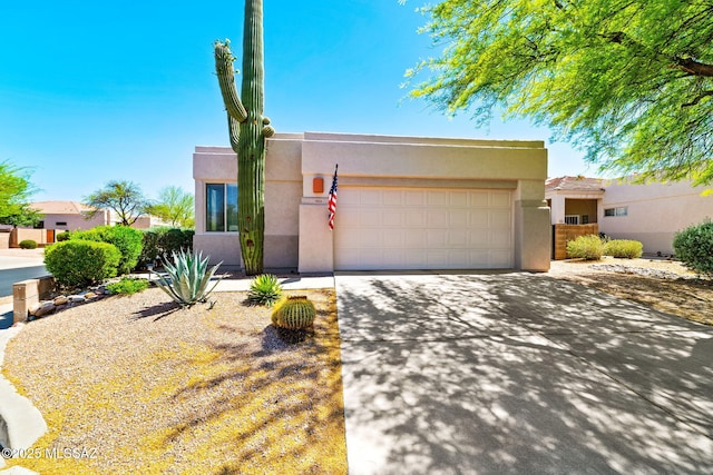 7466 E Placita Del Misterio, Tucson, AZ 85715 - pueblo revival-style home featuring concrete driveway, stucco siding, and an attached garage