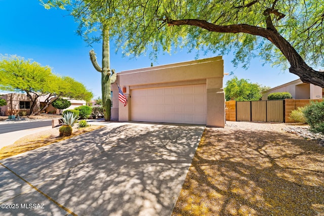 7466 E Placita Del Misterio, Tucson, AZ 85715 - view of front of home with driveway, stucco siding, and an attached garage