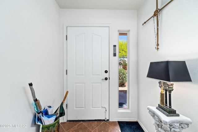 7466 E Placita Del Misterio, Tucson, AZ 85715 - entryway featuring dark tile patterned flooring and baseboards