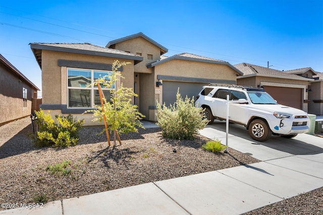 3579 N Kellen Canyon Ct, Tucson, AZ 85745 - view of front of home featuring a garage, concrete driveway, and stucco siding