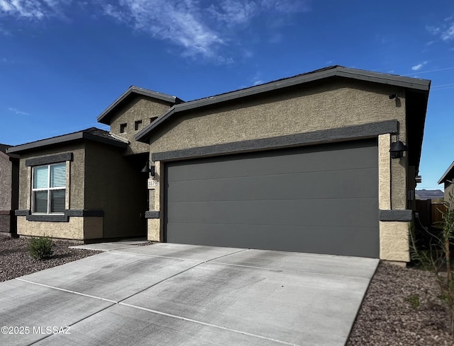 3579 N Kellen Canyon Ct, Tucson, AZ 85745 - view of front of home featuring stucco siding, driveway, and an attached garage
