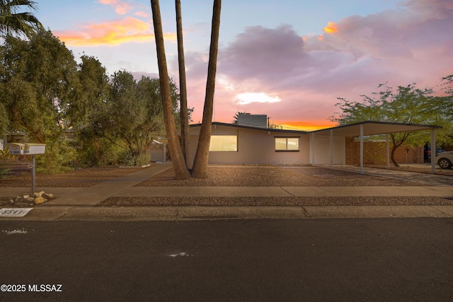 5541 E Mabel St, Tucson, AZ 85712 - view of front of house featuring driveway and an attached carport