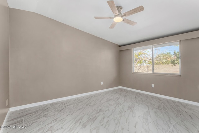 5541 E Mabel St, Tucson, AZ 85712 - unfurnished room with vaulted ceiling, ceiling fan, baseboards, and light marble finish floors
