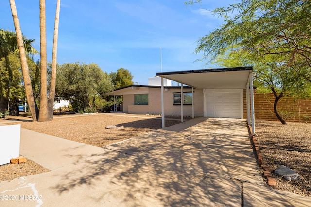 5541 E Mabel St, Tucson, AZ 85712 - view of front of property featuring concrete driveway and brick siding