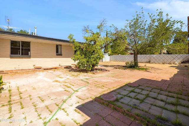 5541 E Mabel St, Tucson, AZ 85712 - fenced backyard with a patio