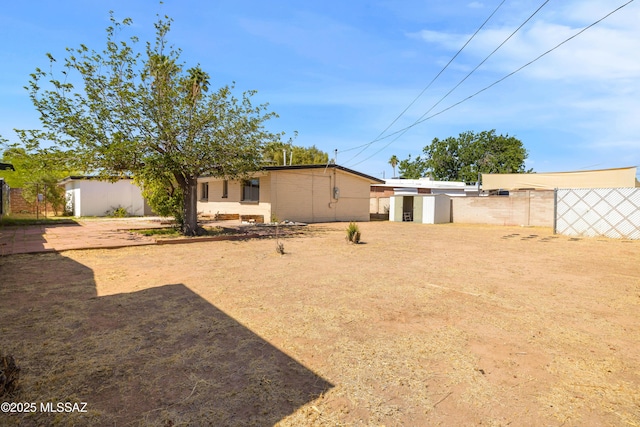 5541 E Mabel St, Tucson, AZ 85712 - rear view of house with a shed