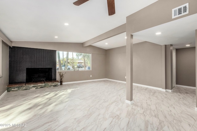 5541 E Mabel St, Tucson, AZ 85712 - below grade area featuring a fireplace with raised hearth, a ceiling fan, baseboards, marble look tile flooring, and recessed lighting