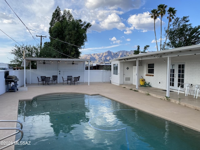 3533 N Palmer Dr, Tucson, AZ 85716 - view of pool with french doors, a grill, a mountain view, a ceiling fan, and a patio