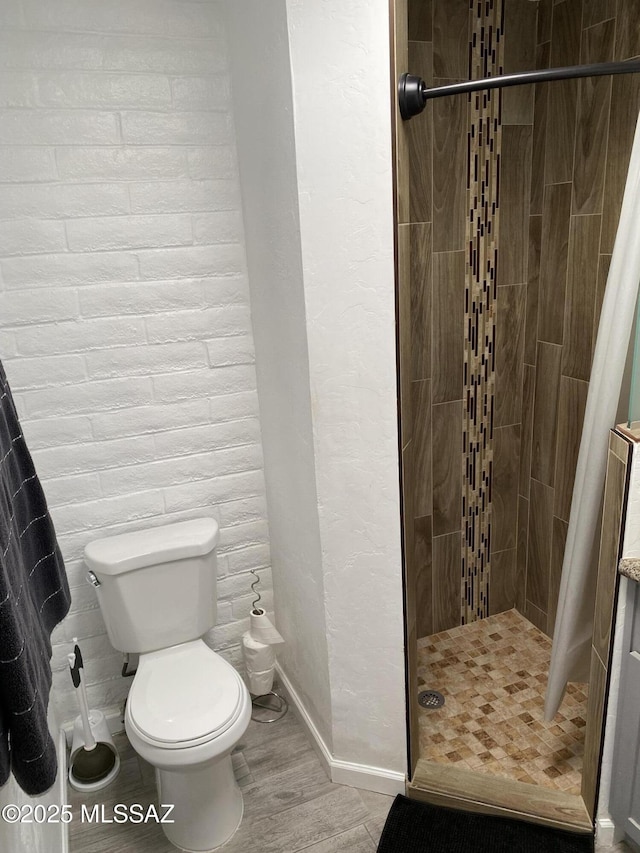 3533 N Palmer Dr, Tucson, AZ 85716 - full bath with a shower stall, toilet, baseboards, and wood finished floors