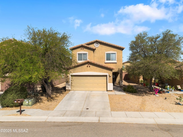 77 N Mail Station Ln, Sahuarita, AZ 85629 - view of front of house featuring a garage, driveway, and stucco siding