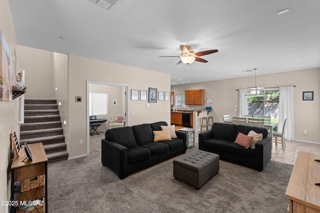 77 N Mail Station Ln, Sahuarita, AZ 85629 - living area with a ceiling fan, stairs, light colored carpet, and baseboards