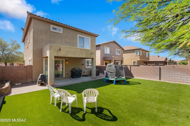77 N Mail Station Ln, Sahuarita, AZ 85629 - rear view of house with stucco siding and a patio area