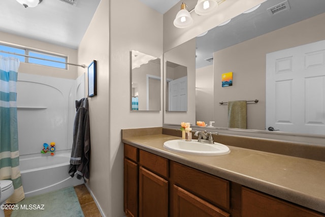 77 N Mail Station Ln, Sahuarita, AZ 85629 - bathroom featuring vanity, shower / tub combo with curtain, tile patterned floors, toilet, and baseboards