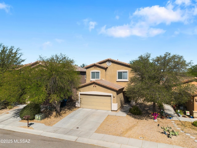 77 N Mail Station Ln, Sahuarita, AZ 85629 - view of front facade featuring an attached garage, concrete driveway, a tiled roof, and stucco siding