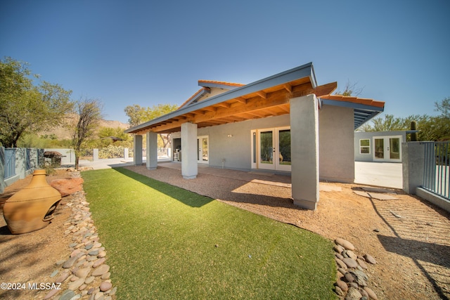 5617 N Camino Del Conde, Tucson, AZ 85718 - back of property featuring french doors, stucco siding, and a patio