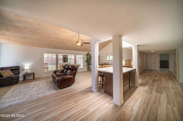 5617 N Camino Del Conde, Tucson, AZ 85718 - living room featuring light wood-style floors, a ceiling fan, baseboards, and lofted ceiling