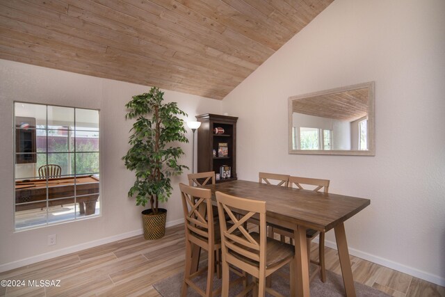 5617 N Camino Del Conde, Tucson, AZ 85718 - dining space with lofted ceiling, wooden ceiling, wood finished floors, healthy amount of natural light, and baseboards