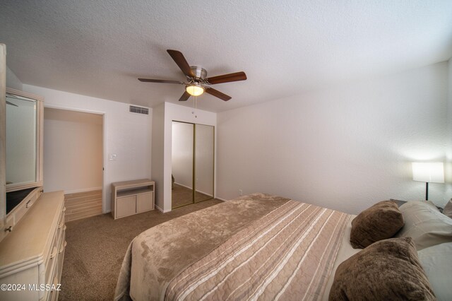 5617 N Camino Del Conde, Tucson, AZ 85718 - carpeted bedroom featuring a closet, ceiling fan, and a textured ceiling
