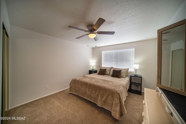 5617 N Camino Del Conde, Tucson, AZ 85718 - carpeted bedroom with baseboards, ceiling fan, and a textured ceiling