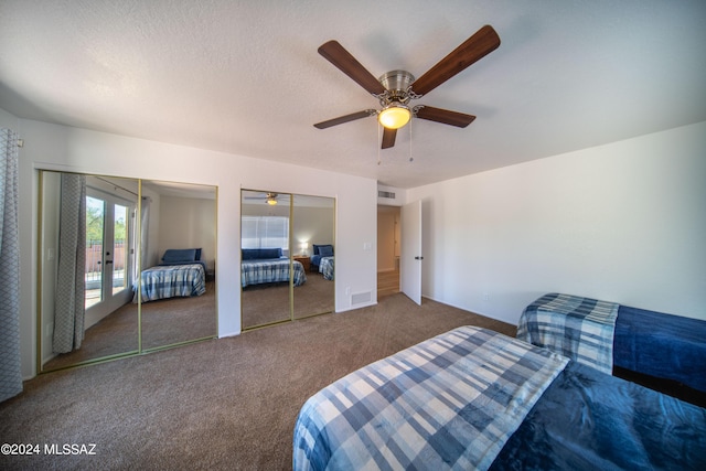 5617 N Camino Del Conde, Tucson, AZ 85718 - bedroom with two closets, carpet flooring, french doors, and a ceiling fan