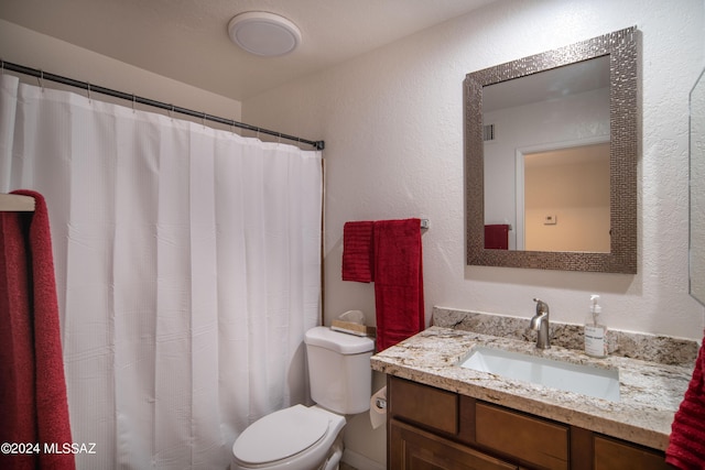 5617 N Camino Del Conde, Tucson, AZ 85718 - bathroom featuring toilet, vanity, a textured wall, and a shower with shower curtain