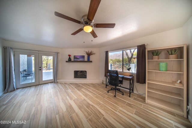5617 N Camino Del Conde, Tucson, AZ 85718 - home office with french doors, wood finished floors, ceiling fan, and baseboards