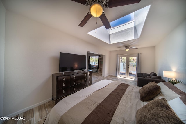 5617 N Camino Del Conde, Tucson, AZ 85718 - bedroom with a skylight, access to exterior, baseboards, and wood finished floors